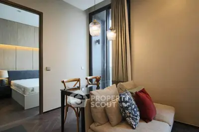 Modern living room with cozy sofa and stylish lighting in a contemporary apartment.