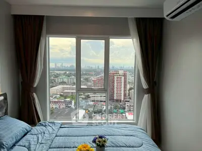 Stunning bedroom with panoramic city view and modern decor