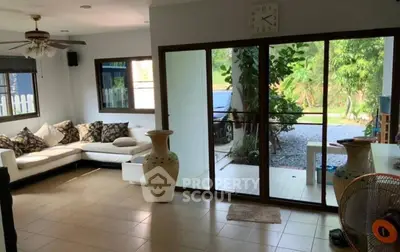 Spacious living room with garden view and elegant decor