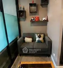 Cozy living room corner with modern decor and stylish shelving