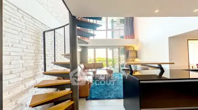 Modern loft with spiral staircase and spacious living area featuring leather sofa and large windows.