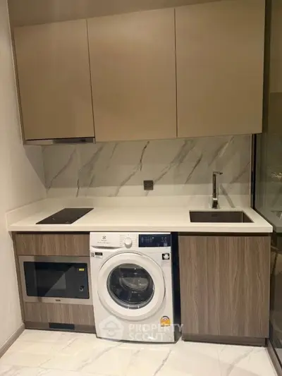 Modern kitchen with integrated appliances and sleek cabinetry