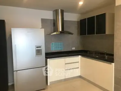 Modern kitchen with stainless steel appliances and sleek cabinetry