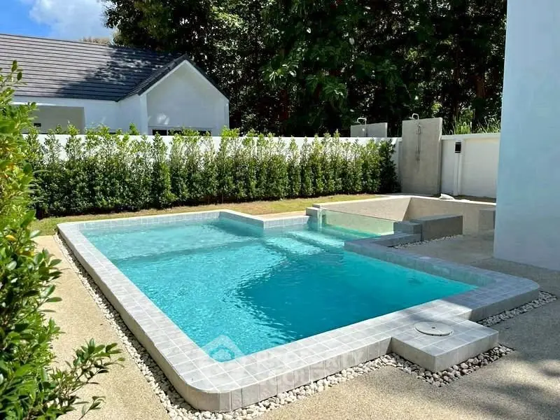 Stunning private pool with modern design in a serene backyard setting.