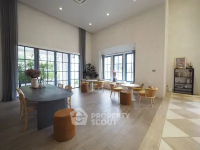Spacious modern living room with elegant decor and large windows