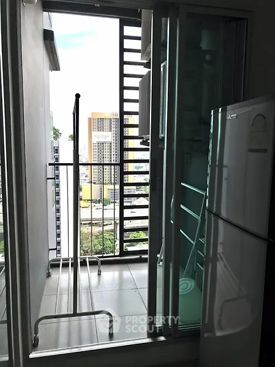 Modern apartment balcony with city view and laundry area, featuring a sleek design and practical amenities.