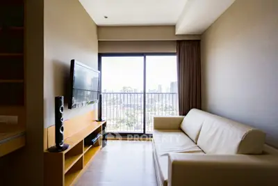 Modern living room with city view, featuring sleek furniture and large window for natural light.