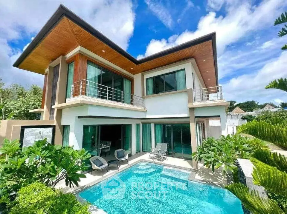 Luxurious modern villa with private pool and lush greenery, perfect for serene living.