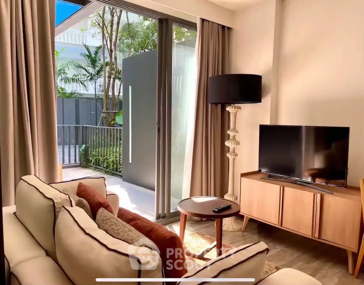 Stylish living room with modern decor and garden view, perfect for relaxation.