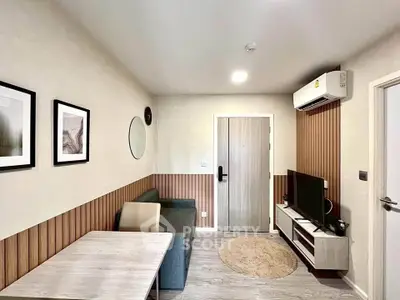 Modern living room with stylish decor and air conditioning in a cozy apartment.