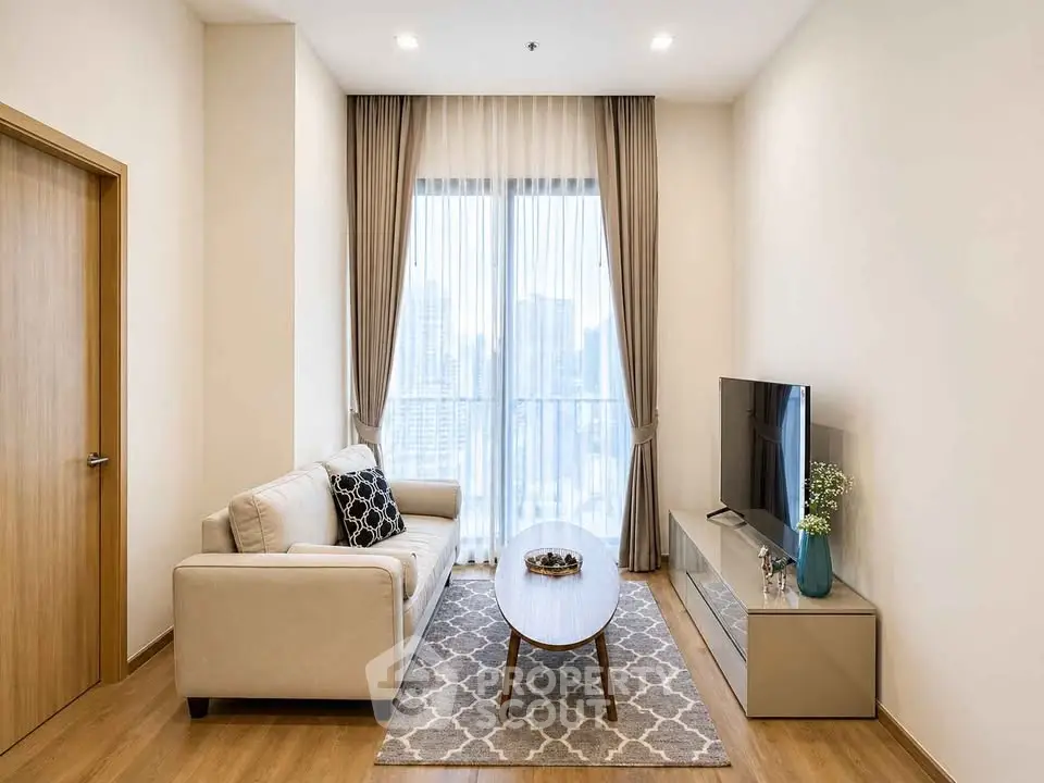 Modern living room with city view, elegant decor, and natural light