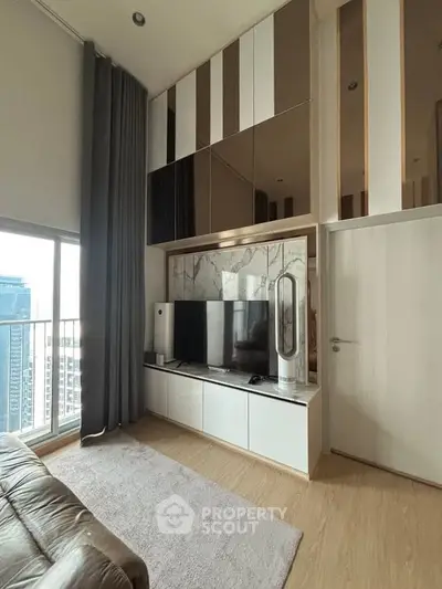 Modern living room with high ceiling and large window offering city view