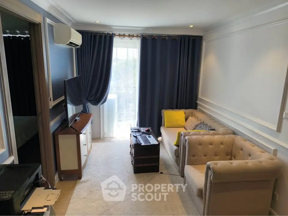 Charming living room with elegant furniture and natural light, perfect for relaxation and entertainment.