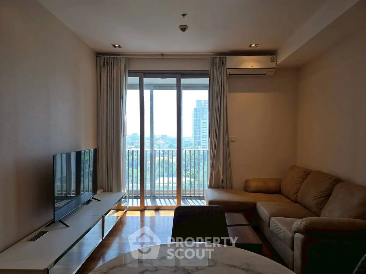 Modern living room with city view and cozy seating area