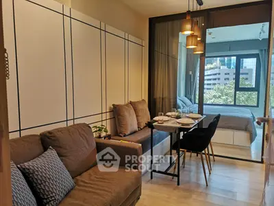 Modern studio apartment with cozy living area and stylish bedroom view.