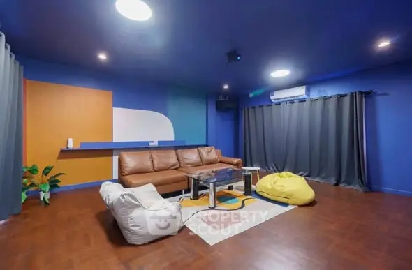 Modern living room with vibrant colors and cozy seating area