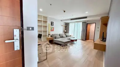 Spacious modern living room with cozy sofa and natural light