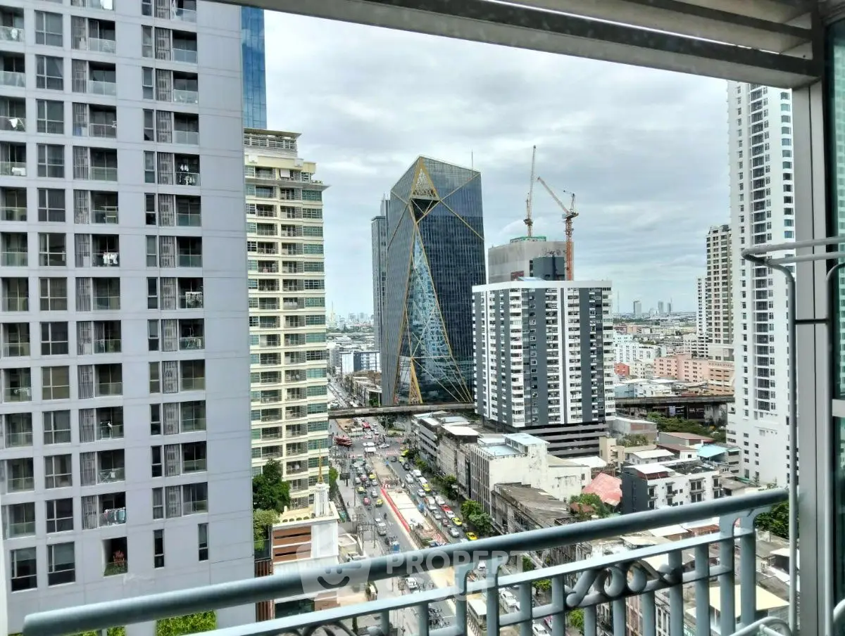 Stunning cityscape view from a high-rise balcony showcasing modern architecture and urban skyline.