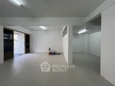 Spacious open-plan interior with minimalist design and ample natural light