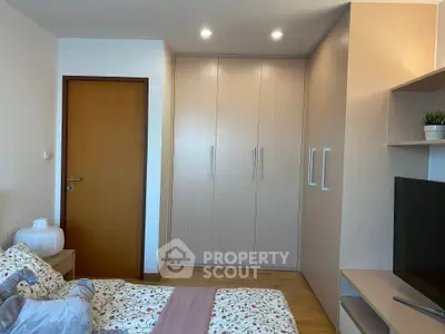 Cozy bedroom with built-in wardrobe and modern decor