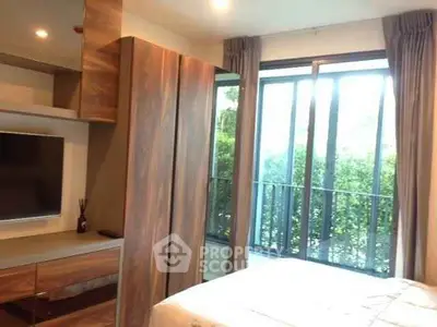 Modern bedroom with large window and stylish wooden furniture, offering a cozy and inviting atmosphere.