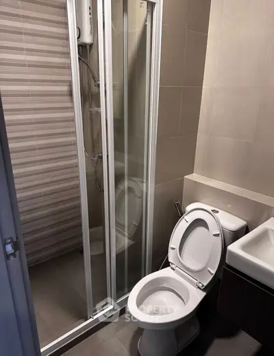Modern bathroom with shower and toilet in compact space