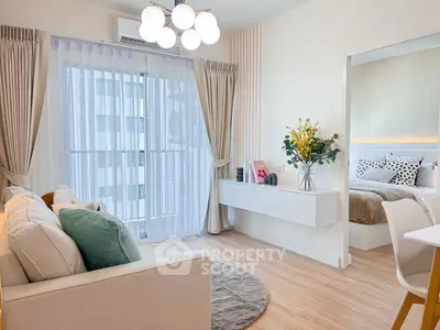 Modern living room with cozy sofa and elegant decor in a stylish apartment.