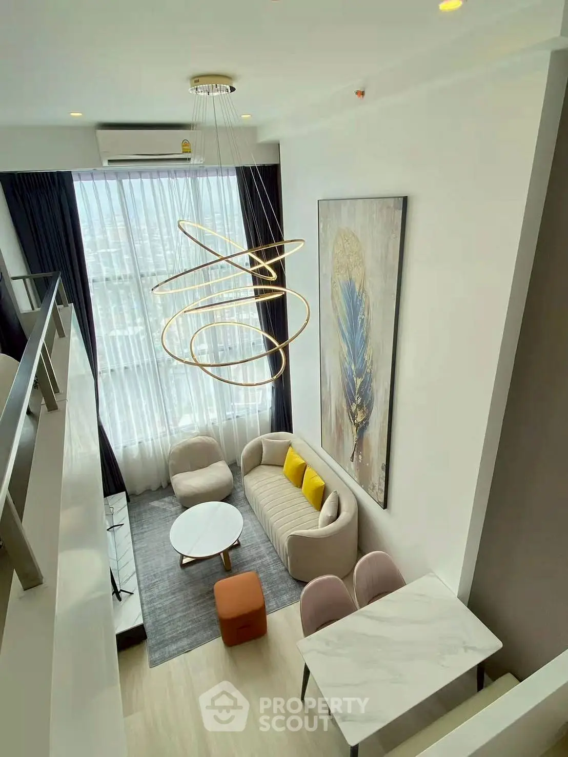 Modern loft-style living room with high ceilings and elegant lighting in a chic apartment.