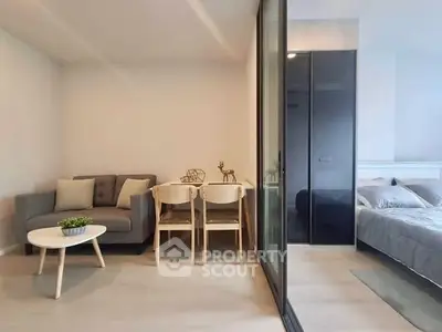 Modern studio apartment with cozy living area and stylish bedroom