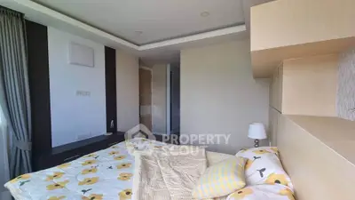 Cozy bedroom with floral bedding and modern design, featuring ample natural light and stylish decor.