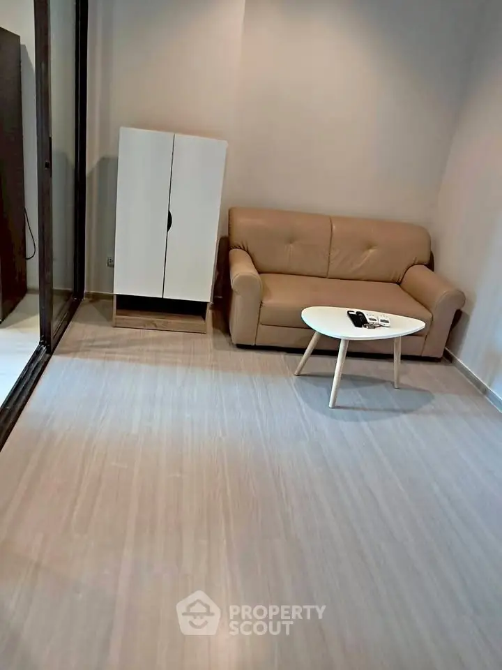 Cozy living room with beige sofa and modern coffee table