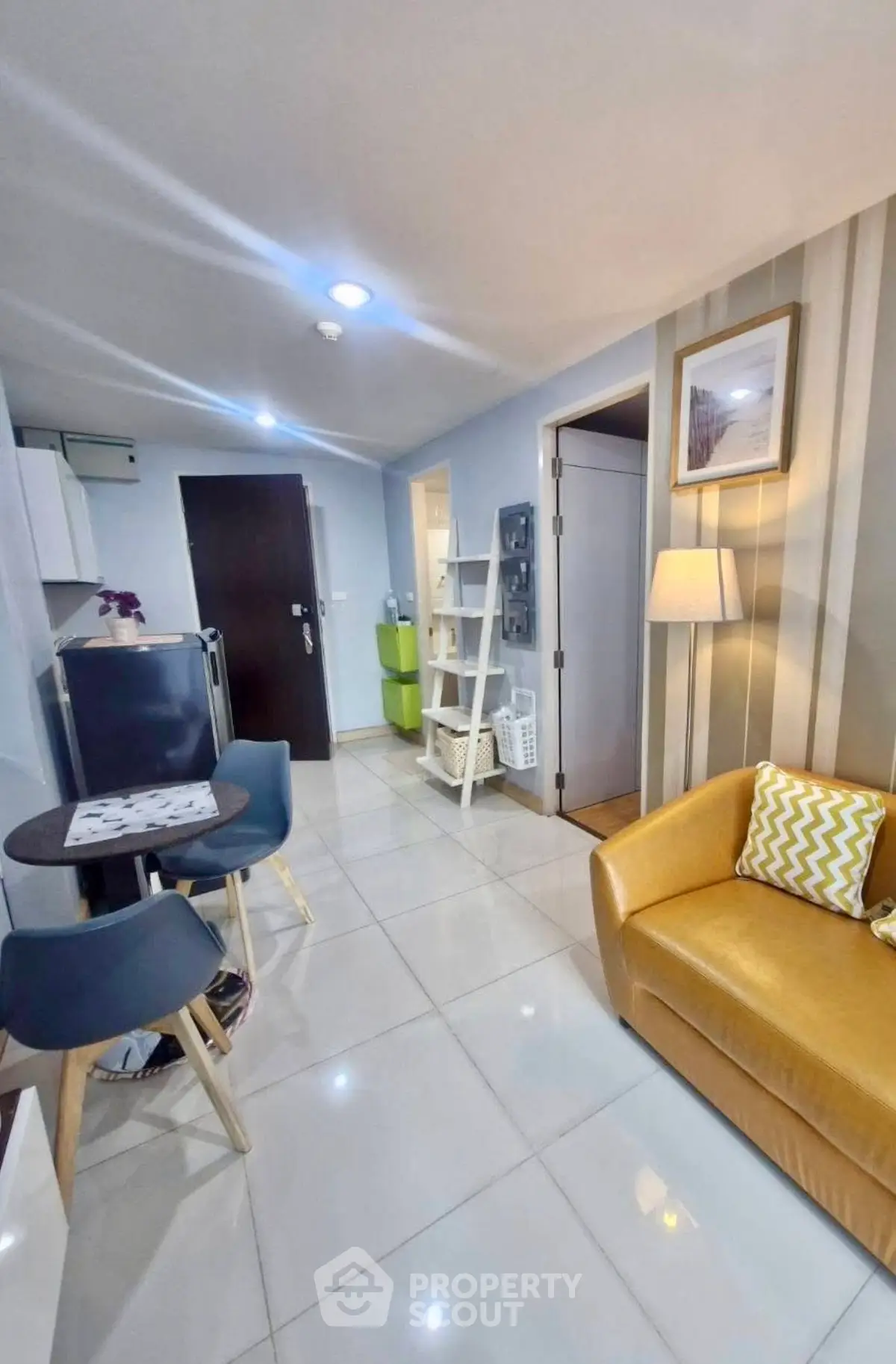 Modern living room with stylish decor and cozy seating in a contemporary apartment.