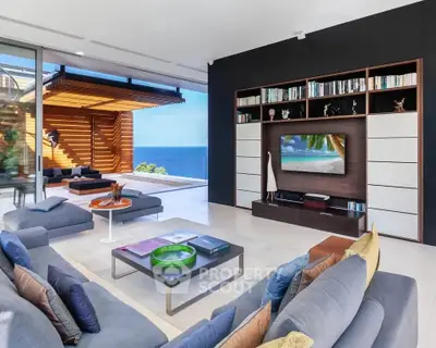 Luxurious living room with ocean view, modern decor, and spacious seating area.