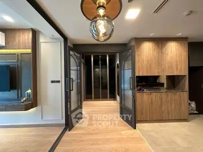 Luxurious modern interior with elegant wooden finishes and glass doors, perfect for sophisticated living.