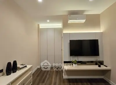 Modern living room with sleek TV setup and elegant decor