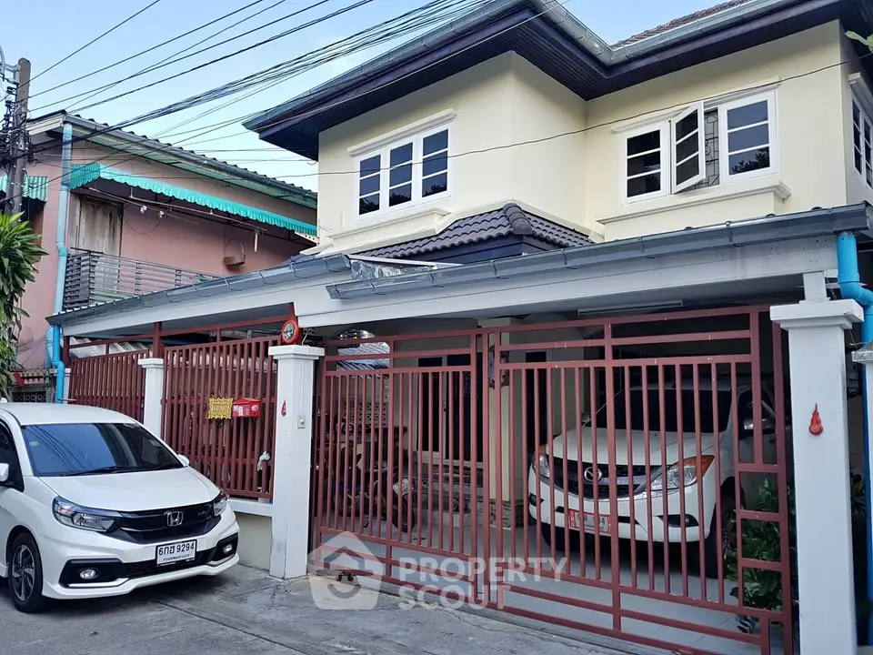 Charming two-story house with gated parking and modern design