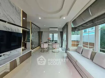 Luxurious modern living room with elegant decor and large windows