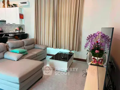Modern living room with sleek furniture and elegant decor, featuring a cozy sectional sofa and stylish coffee table.