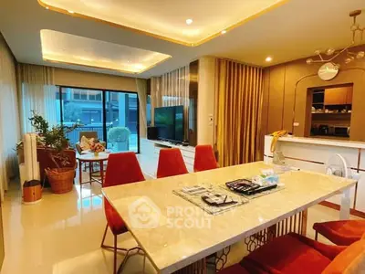 Luxurious open-plan living room with elegant dining area and modern decor