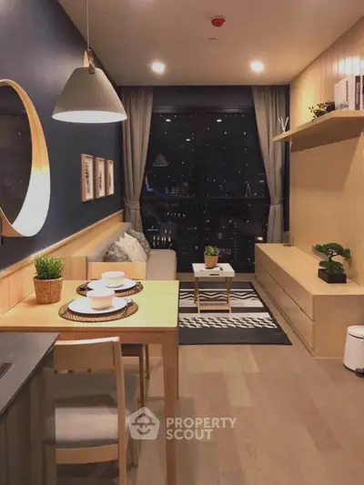 Stylish modern living room with cozy dining area and city view, perfect for urban living.