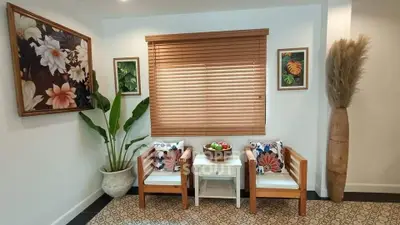 Charming interior with cozy seating and stylish decor, perfect for relaxation.
