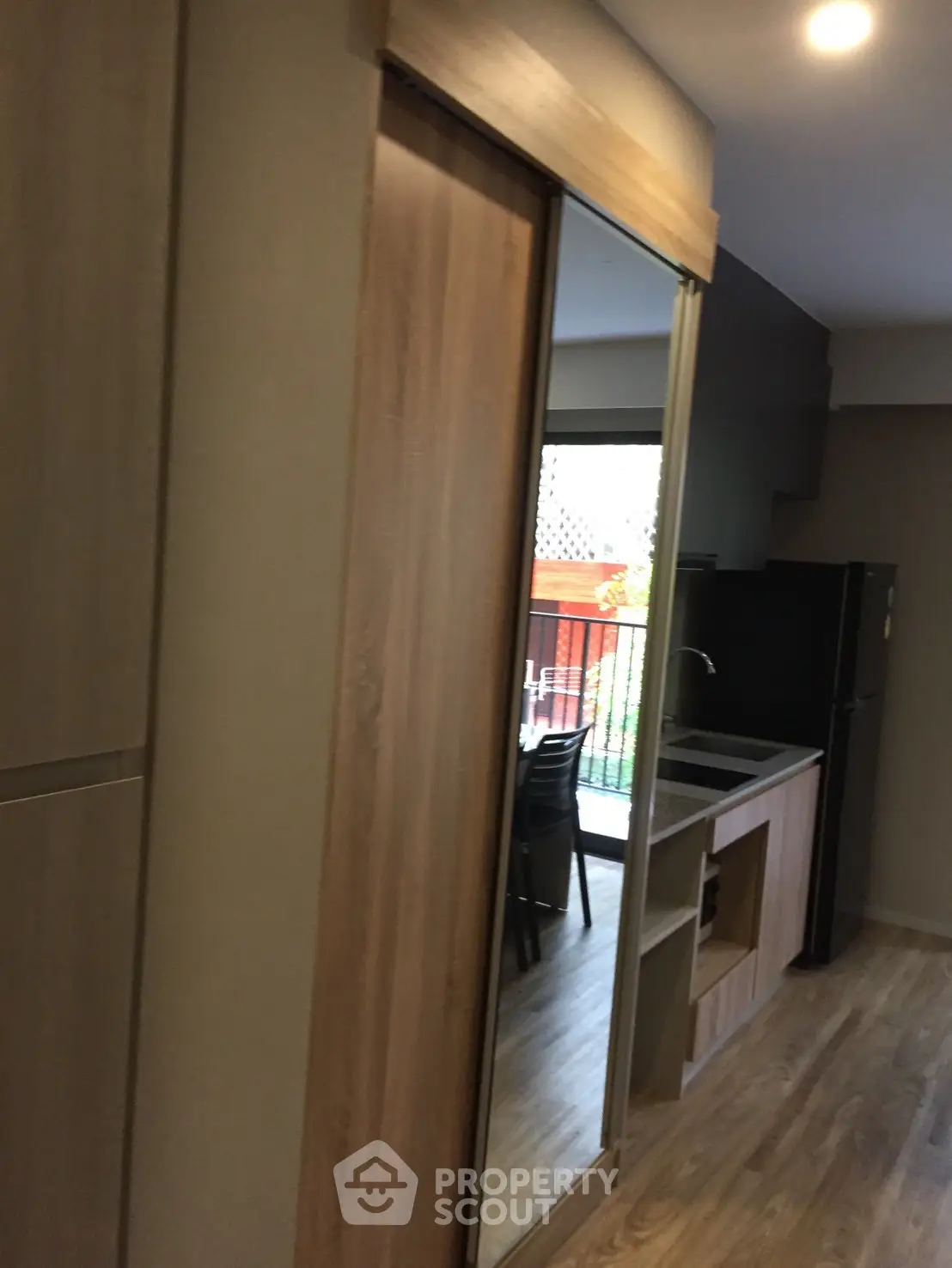 Modern kitchen with sleek wooden cabinetry and open layout design