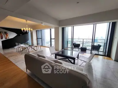 Luxurious open-plan living room with stunning city view and elegant dining area.