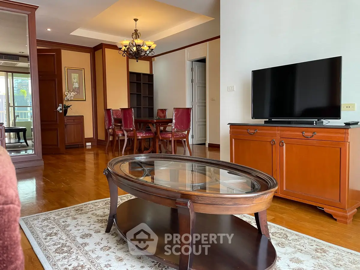 Elegant living room with classic wooden furniture and modern TV setup