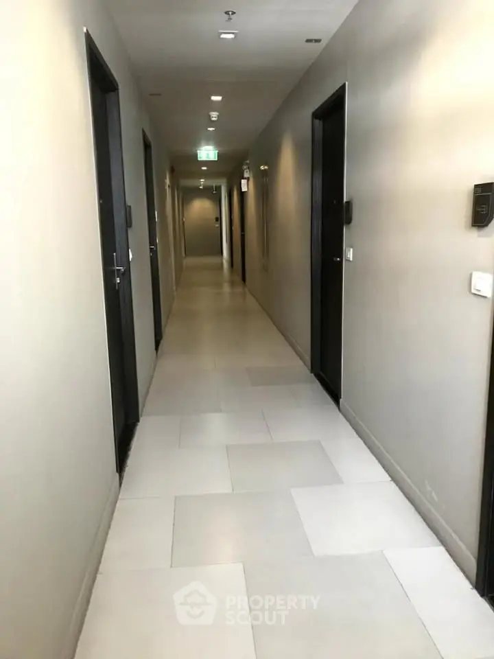 Modern apartment corridor with sleek design and ambient lighting