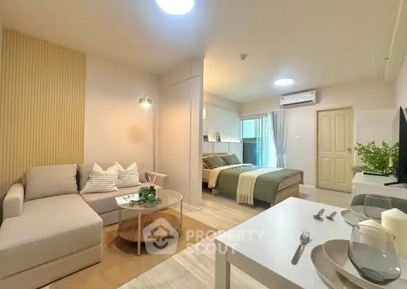 Modern studio apartment with cozy living area and stylish decor