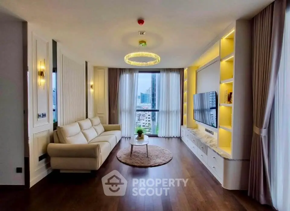 Luxurious modern living room with elegant decor and city view, featuring a cozy sofa and stylish lighting.