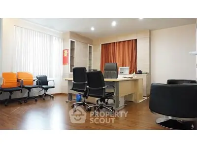 Modern office space with sleek furniture and wooden flooring