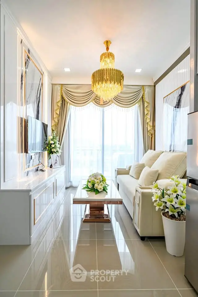Luxurious living room with elegant chandelier and floor-to-ceiling windows