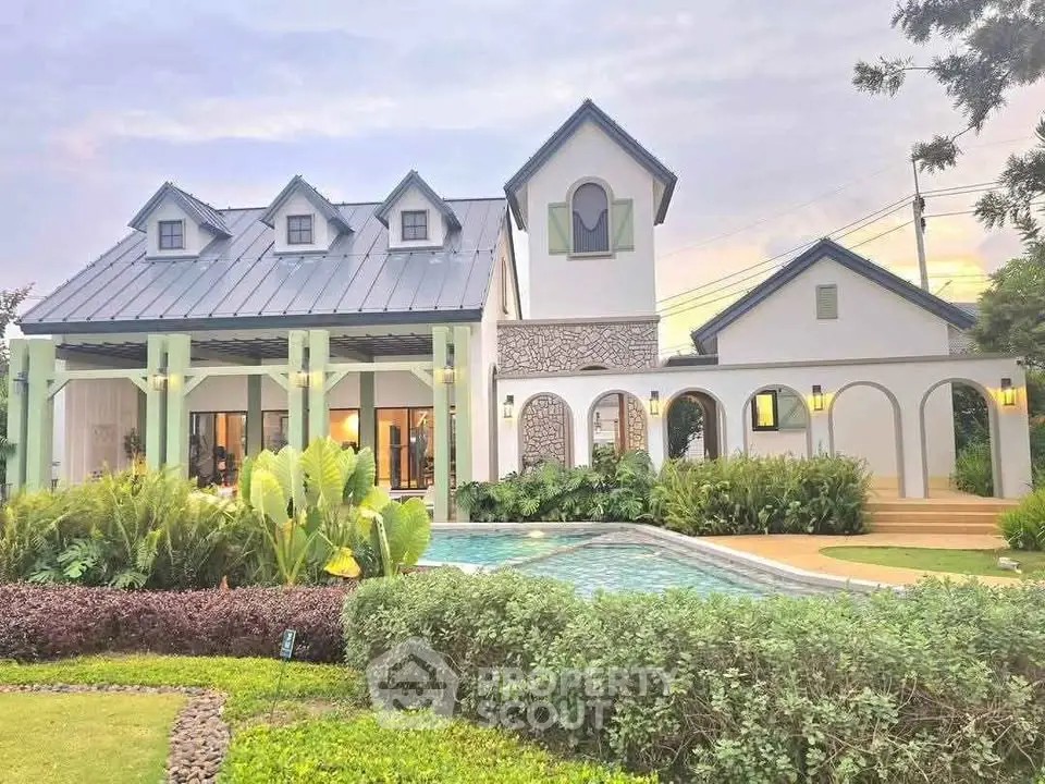 Charming countryside home with elegant architecture and inviting pool